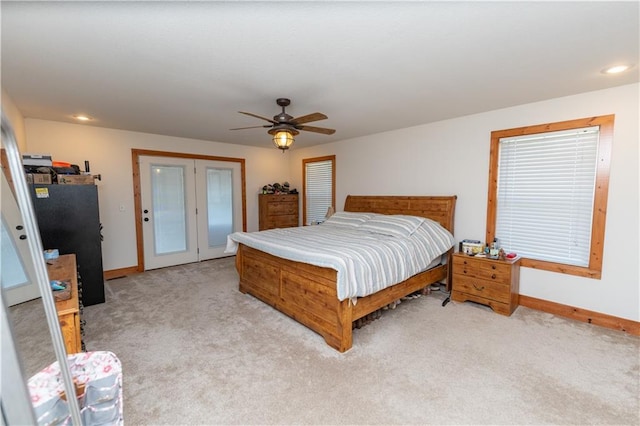 29309 E State Route B, Archie, MO 64725 - bedroom with light colored carpet, french doors, a ceiling fan, and recessed lighting