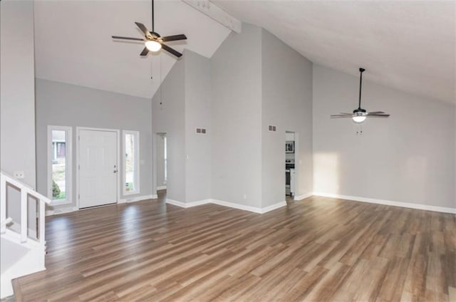 127 E Nelson Cir, Olathe, KS 66061 - unfurnished living room with a ceiling fan, high vaulted ceiling, wood finished floors, beamed ceiling, and stairs
