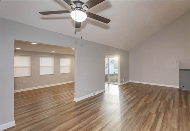 127 E Nelson Cir, Olathe, KS 66061 - unfurnished living room featuring ceiling fan, wood finished floors, vaulted ceiling, and recessed lighting