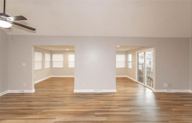127 E Nelson Cir, Olathe, KS 66061 - unfurnished living room featuring ceiling fan, wood finished floors, and recessed lighting