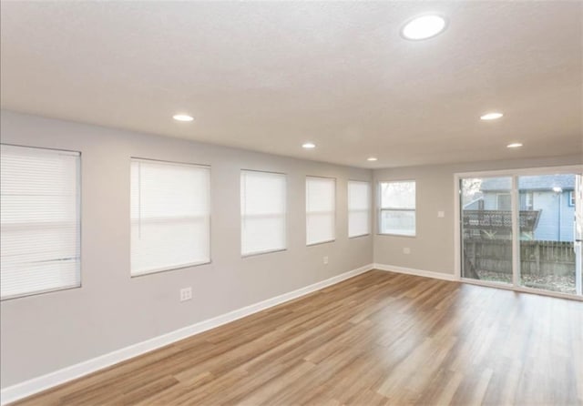 127 E Nelson Cir, Olathe, KS 66061 - spare room with light wood-type flooring and recessed lighting