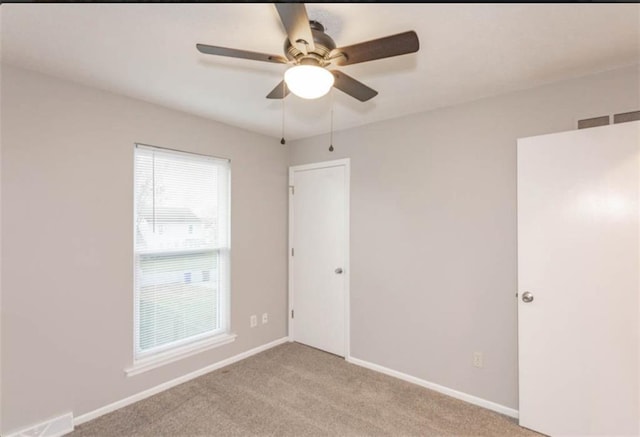 127 E Nelson Cir, Olathe, KS 66061 - unfurnished bedroom featuring light carpet and ceiling fan