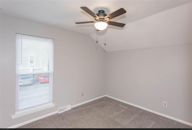 127 E Nelson Cir, Olathe, KS 66061 - unfurnished room featuring carpet flooring, ceiling fan, healthy amount of natural light, and vaulted ceiling
