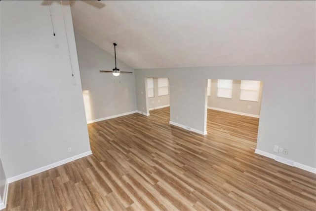 127 E Nelson Cir, Olathe, KS 66061 - unfurnished living room with ceiling fan, vaulted ceiling, and light wood-style flooring