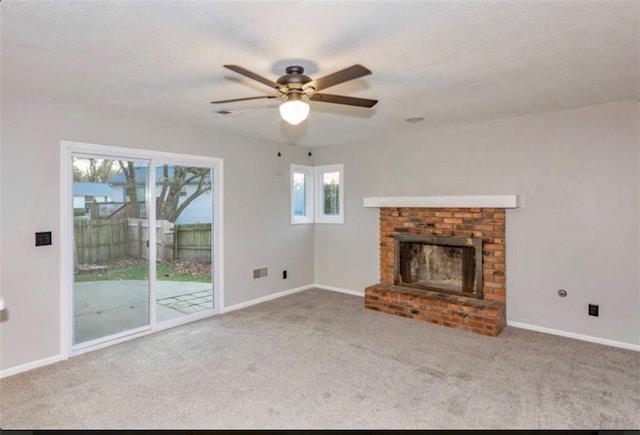 127 E Nelson Cir, Olathe, KS 66061 - unfurnished living room featuring carpet flooring, ceiling fan, and a brick fireplace