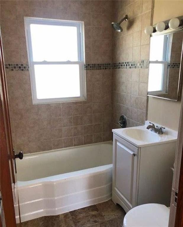 10216 W 60th Ter, Shawnee, KS 66203 - full bathroom featuring vanity and bathing tub / shower combination