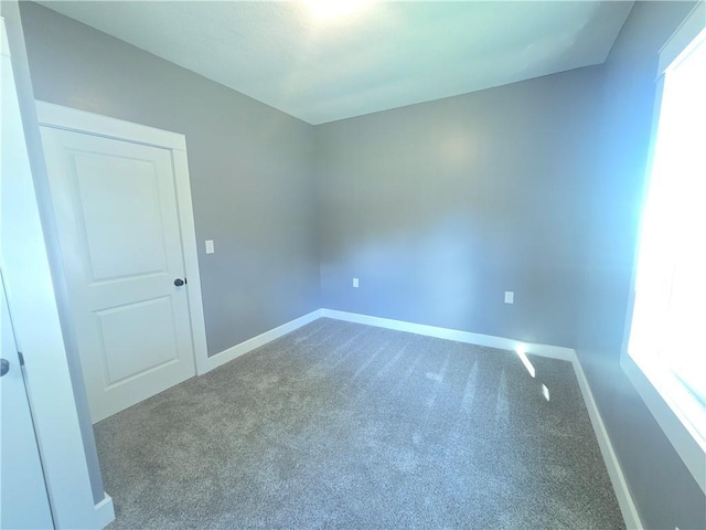 2113 Jefferson St, Lexington, MO 64067 - carpeted empty room with baseboards