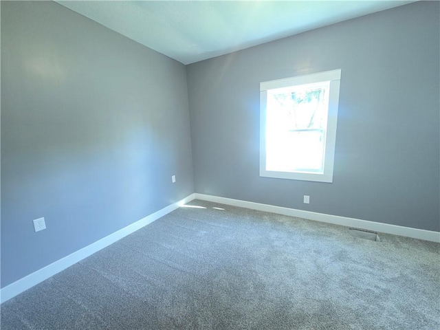 2113 Jefferson St, Lexington, MO 64067 - spare room with baseboards and carpet