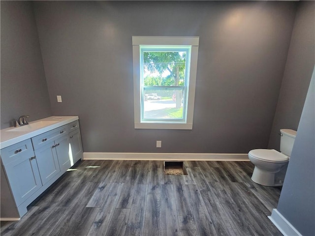 2113 Jefferson St, Lexington, MO 64067 - half bath featuring wood finished floors and vanity