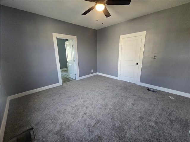 2113 Jefferson St, Lexington, MO 64067 - unfurnished bedroom featuring carpet and ceiling fan