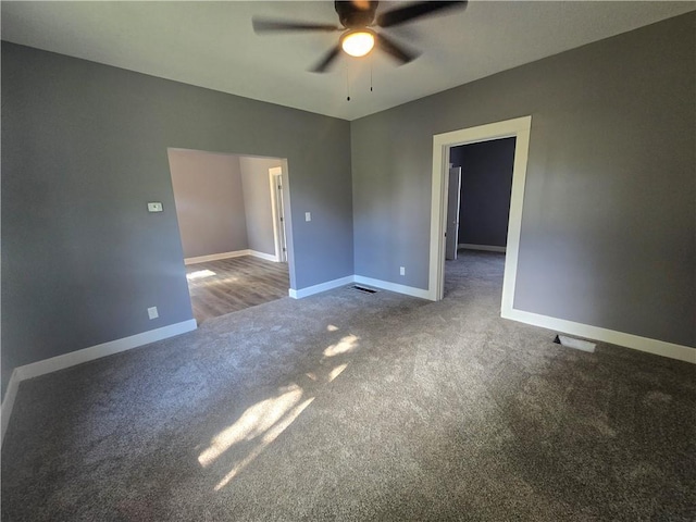 2113 Jefferson St, Lexington, MO 64067 - carpeted empty room featuring a ceiling fan and baseboards