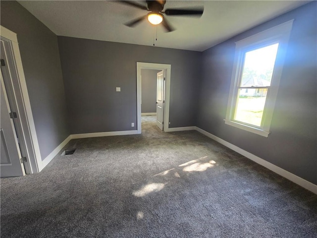 2113 Jefferson St, Lexington, MO 64067 - carpeted spare room with ceiling fan and baseboards