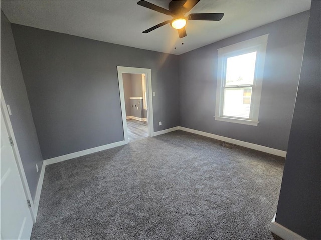 2113 Jefferson St, Lexington, MO 64067 - empty room with a ceiling fan and carpet flooring