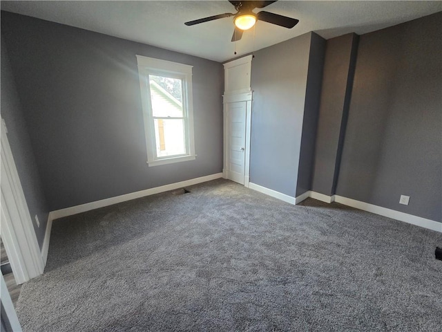 2113 Jefferson St, Lexington, MO 64067 - unfurnished bedroom featuring carpet floors and ceiling fan