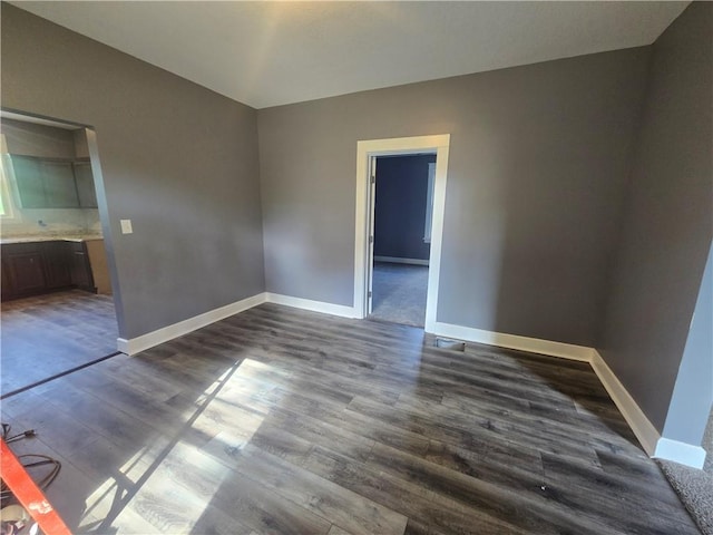 2113 Jefferson St, Lexington, MO 64067 - unfurnished bedroom with dark wood-style flooring and connected bathroom