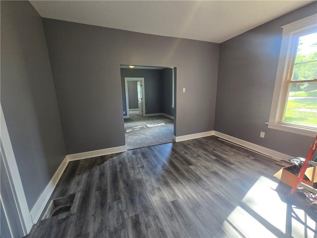 2113 Jefferson St, Lexington, MO 64067 - empty room with dark wood finished floors and baseboards