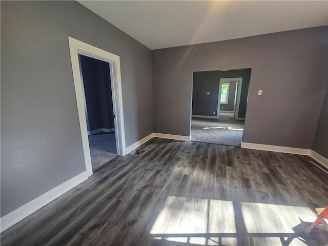 2113 Jefferson St, Lexington, MO 64067 - spare room with dark wood finished floors and baseboards