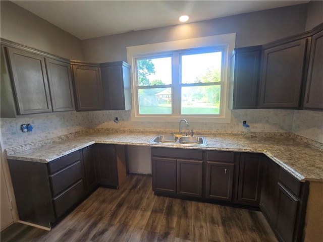 2113 Jefferson St, Lexington, MO 64067 - kitchen with dark wood finished floors, light countertops, and backsplash
