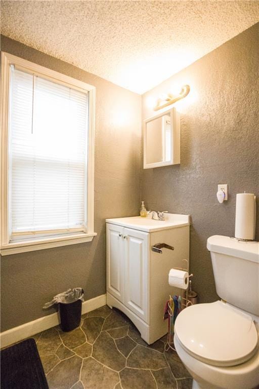 5521-3 Wabash Ave, Kansas City, MO 64130 - half bath with vanity, tile patterned flooring, and a textured ceiling