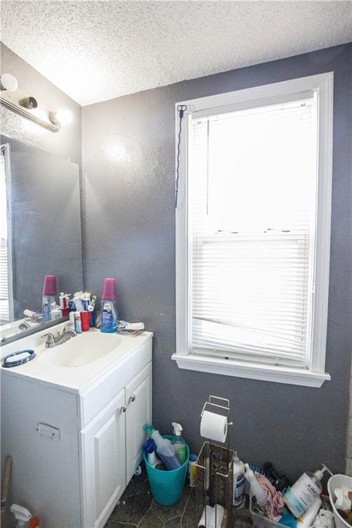 5521-3 Wabash Ave, Kansas City, MO 64130 - bathroom with vanity and a textured ceiling