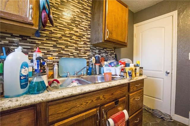 5521-3 Wabash Ave, Kansas City, MO 64130 - kitchen featuring tasteful backsplash, brown cabinets, and light countertops