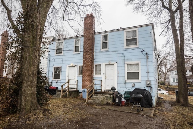 5521-3 Wabash Ave, Kansas City, MO 64130 - back of property with a chimney and entry steps