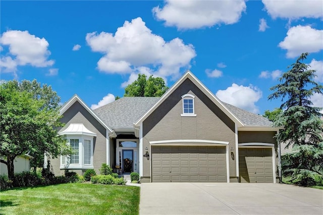 14780 S Glen Eyrie St, Olathe, KS 66061 - traditional-style home with driveway, a front lawn, a garage, and stucco siding
