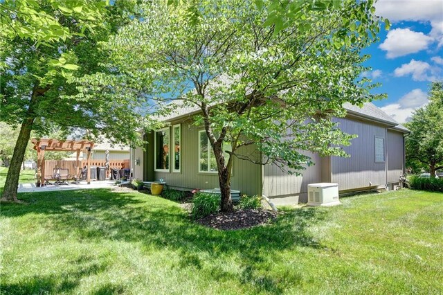 14780 S Glen Eyrie St, Olathe, KS 66061 - back of house with a pergola, a patio area, and a lawn