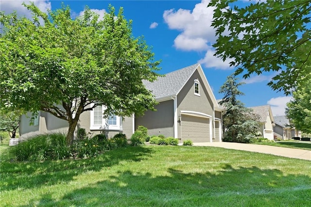 14780 S Glen Eyrie St, Olathe, KS 66061 - view of front of property featuring concrete driveway, a front lawn, and stucco siding