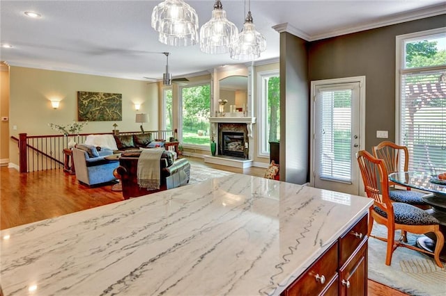 14780 S Glen Eyrie St, Olathe, KS 66061 - dining space with ornamental molding, light wood-type flooring, healthy amount of natural light, a ceiling fan, and recessed lighting