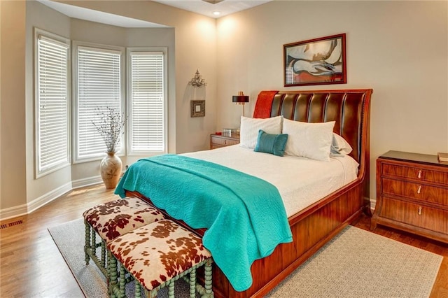 14780 S Glen Eyrie St, Olathe, KS 66061 - bedroom featuring baseboards and wood finished floors