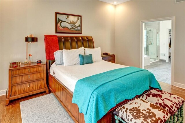 14780 S Glen Eyrie St, Olathe, KS 66061 - bedroom featuring wood finished floors and ensuite bathroom