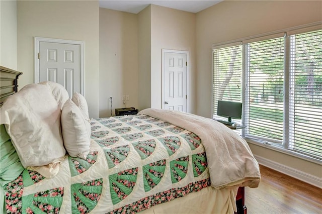 14780 S Glen Eyrie St, Olathe, KS 66061 - bedroom featuring multiple windows and wood finished floors