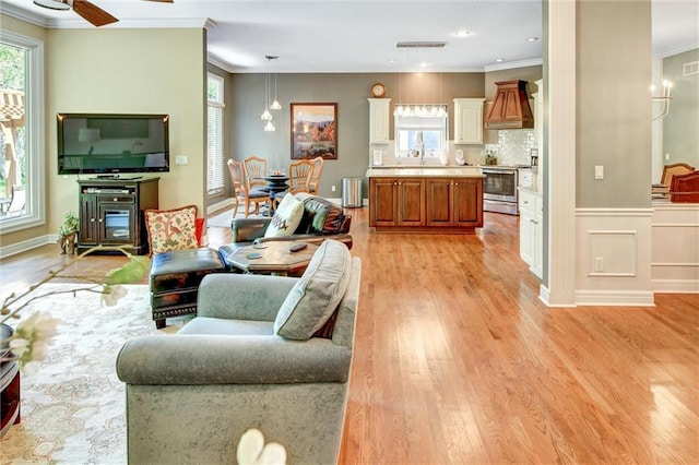 14780 S Glen Eyrie St, Olathe, KS 66061 - living room with crown molding, light wood finished floors, a ceiling fan, and recessed lighting