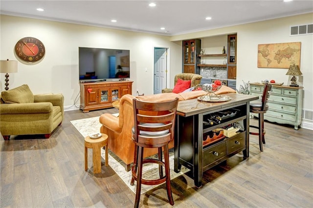 14780 S Glen Eyrie St, Olathe, KS 66061 - bar area with recessed lighting, wood finished floors, and crown molding