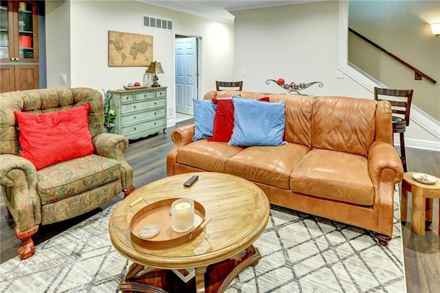 14780 S Glen Eyrie St, Olathe, KS 66061 - living area with wood finished floors, ornamental molding, and stairs