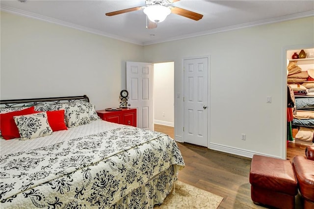 14780 S Glen Eyrie St, Olathe, KS 66061 - bedroom with crown molding, wood finished floors, ceiling fan, and a spacious closet