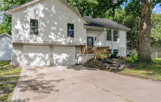 1101 SW Kingscross Rd, Blue Springs, MO 64014 - raised ranch with brick siding, a garage, and driveway