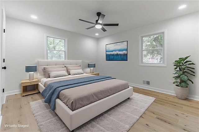 1101 SW Kingscross Rd, Blue Springs, MO 64014 - bedroom featuring light wood finished floors, recessed lighting, and a ceiling fan