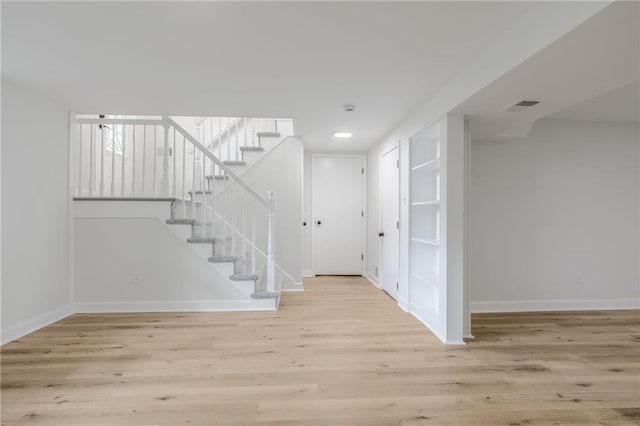 1101 SW Kingscross Rd, Blue Springs, MO 64014 - below grade area with stairway, wood finished floors, and recessed lighting