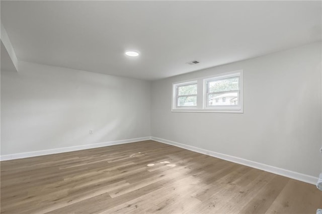 1101 SW Kingscross Rd, Blue Springs, MO 64014 - unfurnished room with baseboards and light wood-style flooring