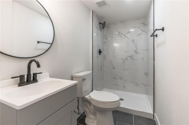 1101 SW Kingscross Rd, Blue Springs, MO 64014 - bathroom featuring vanity, a tile shower, and tile patterned flooring
