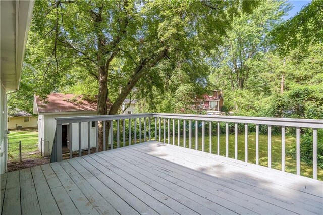 1101 SW Kingscross Rd, Blue Springs, MO 64014 - wooden deck featuring a lawn
