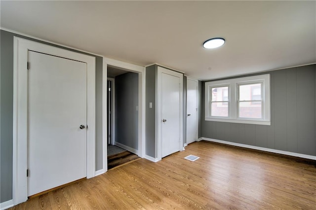 3624 Norledge Ave, Kansas City, MO 64123 - unfurnished bedroom featuring light wood-style flooring and baseboards