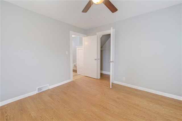 3624 Norledge Ave, Kansas City, MO 64123 - unfurnished bedroom with light wood finished floors, a closet, and ceiling fan