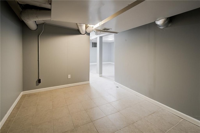 3624 Norledge Ave, Kansas City, MO 64123 - finished below grade area with baseboards and tile patterned flooring