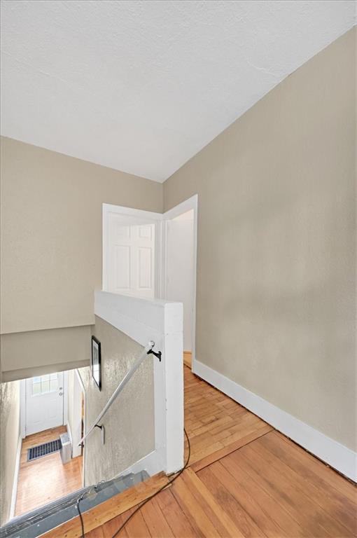 319 Market St, Leavenworth, KS 66048 - stairs with wood finished floors and baseboards