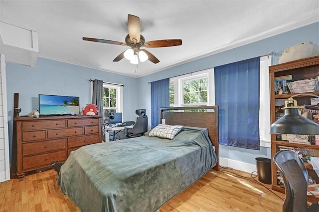 319 Market St, Leavenworth, KS 66048 - bedroom featuring light wood finished floors, ornamental molding, and a ceiling fan
