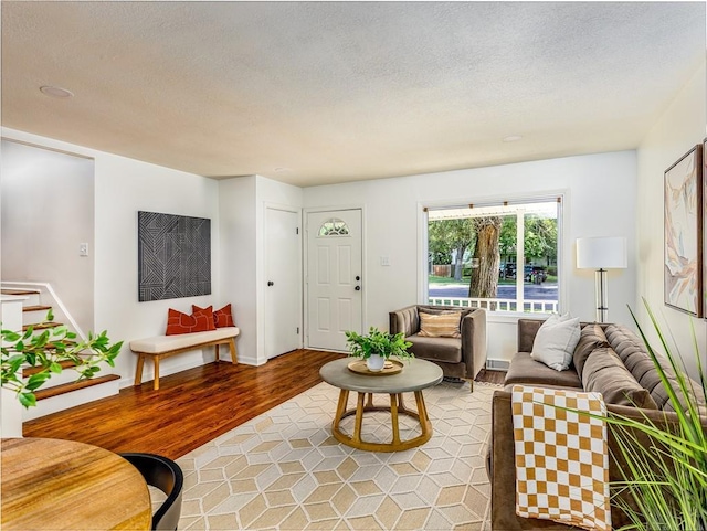 10013 Benson St, Overland Park, KS 66212 - living room featuring light wood-style floors and a textured ceiling