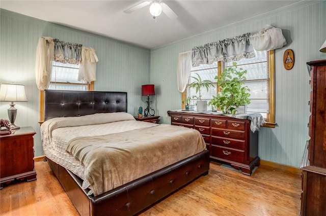 3021 Appleton Ave, Independence, MO 64052 - bedroom with wood finished floors, crown molding, and ceiling fan